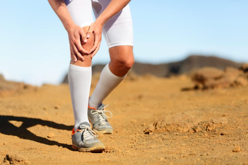 Running injury Male runner with knee pain