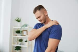 Man back neck and shoulder pain, inflammation of muscles and ligaments rupture during sports